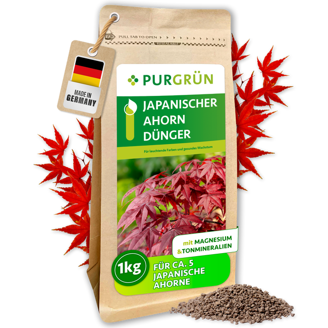 Purgrün Japanischer-Ahorn-Dünger im 1-kg-Beutel, umrahmt von roten Ahornblättern, mit Granulathaufen und „Made in Germany“-Anhänger.
