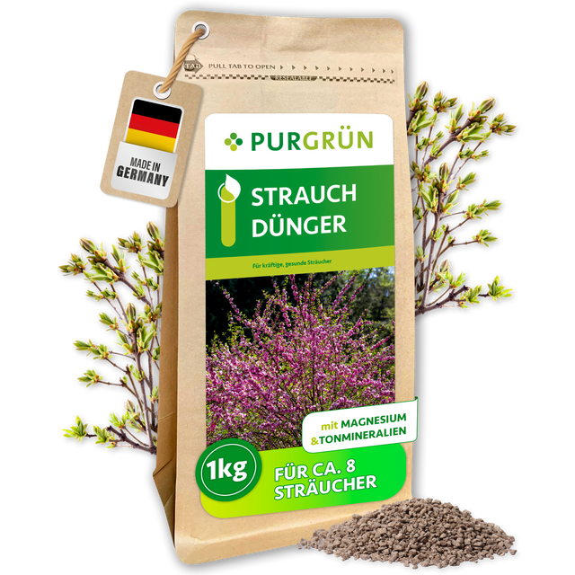 Purgrün Strauchdünger, 1 kg, im wiederverschließbaren Standbeutel mit Blütenstrauch-Motiv und feinem Granulat.